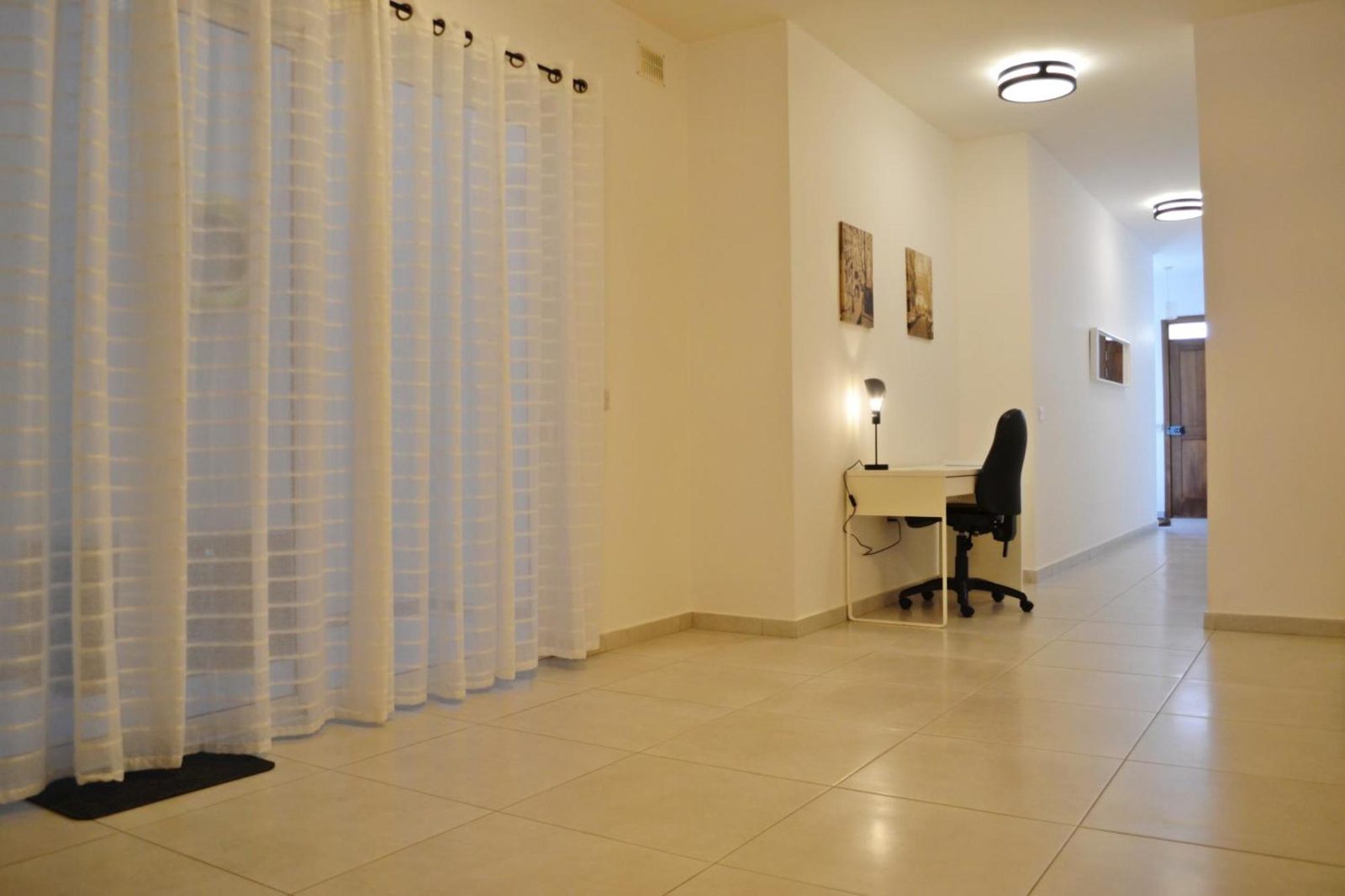 Quiet workspace nook with desk, chair and natural light — ideal for remote work